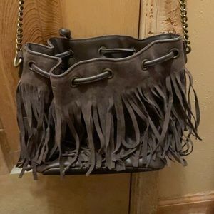 Straps come with adjustable and fringes are leather